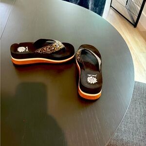 Yellow box flip flops